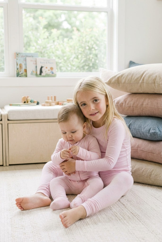 Sisters in matching pink bamboo sleepwear